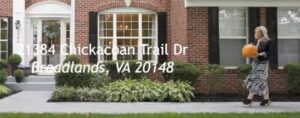 Front view of 21384 Chickacoan Trail Drive in Broadlands, VA with lush landscaping and welcoming entrance